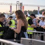 Bag search at a festival entrance carried out by event security staff